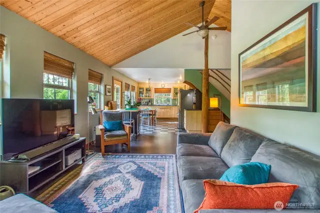 This view is looking into the space from the east side of the room by the wood stove.