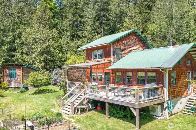 There is a large lovely deck overlooking the garden and the various flowering trees and shrubs.
