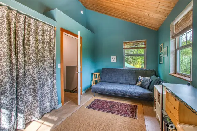 The vaulted ceilings add even more light making this a perfect guest space or office.