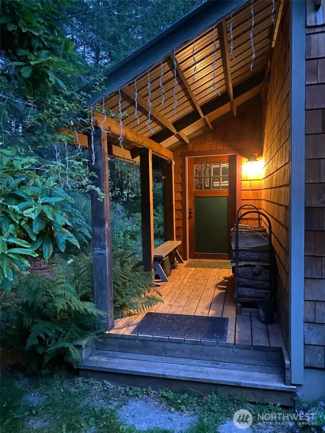 The cottage's covered front porch entrance embraces you into the cottage.