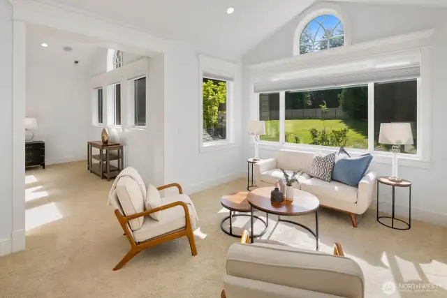 Sitting area of primary suite allows private views of back yard.