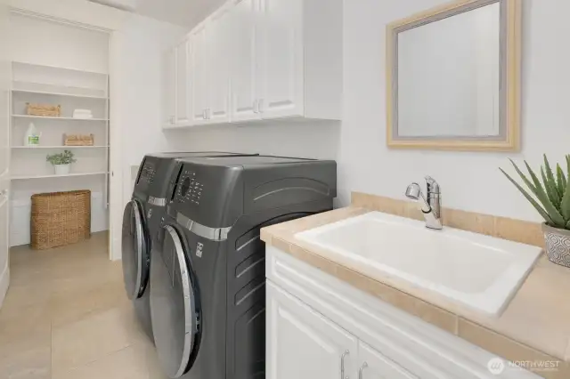 Upstairs laundry with extra large closet, cabinets and sink. Oh yeah don't forget about the two dual washer/dryer combo units, makes it ok to set it and forget it. They will wash and then dry for you without having to move loads.