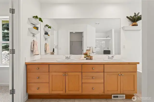 Double vanities in this light and bright primary bath