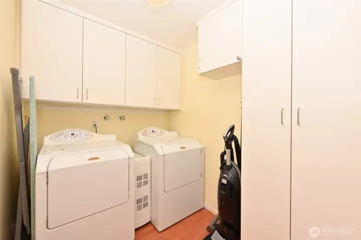 Utility Room with full sized washer and dryer.