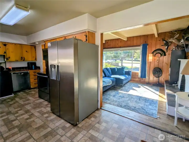 View of living room space open to kitchen dining area
