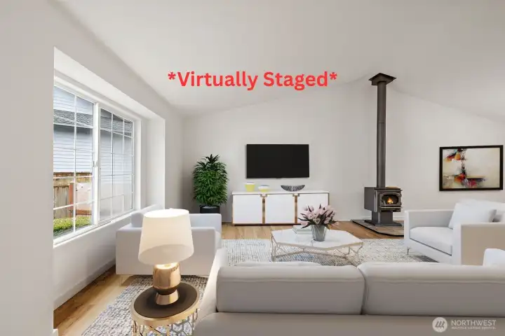 *Virtually Staged* Enter into the spacious living room w/wood burning stove