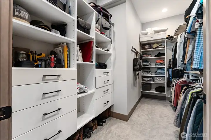 Primary walk-in Closet with custom built in storage!