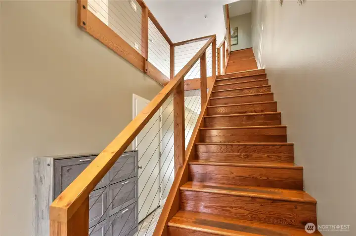 Gorgeous hardwood stairs lead to the second level.