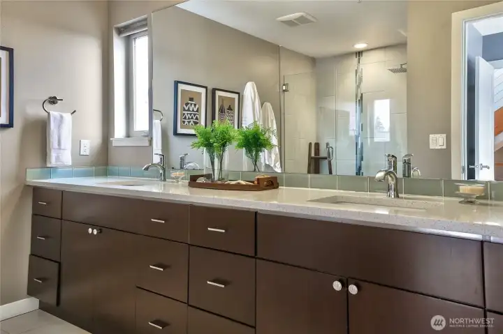 Primary bath with dual vanity.