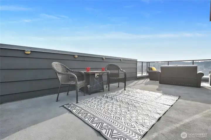 A special place to relax and entertain. This rare rooftop deck offers unobstructed views of the lake, seaplanes and boats in Lake Washington.