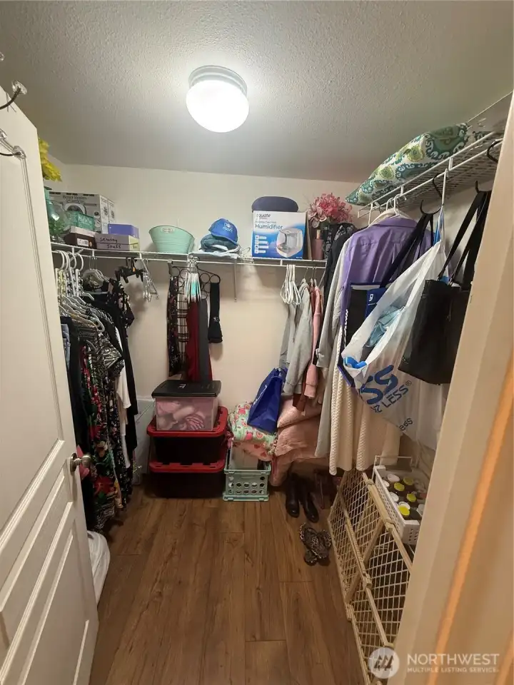 Primary bedroom walk in closet