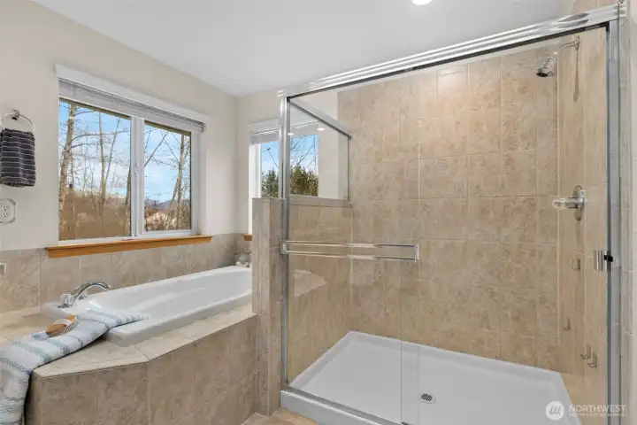 Enjoy the choice of a long soak in the tub or a refreshing shower, all surrounded by timeless, neutral finishes.