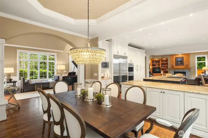 Beautiful wood floors throughout the main level. The floorplan provides flexible and comfortable living, including a den/office and upper-floor bonus room with surround sound.  Dual staircases provide easy access to the upper level.