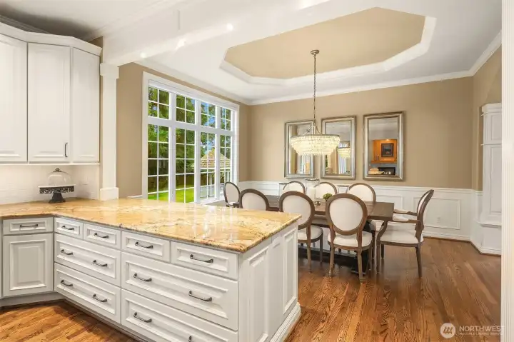 Gorgeous, spotless, expanded and remodeled Chef's kitchen ~ granite counters, huge island, eating bar, 6-burner Wolfe range, double ovens, SubZero fridge and abundant cabinet & counter space.