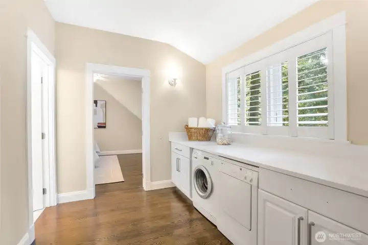 Large upstairs laundry area with massive counter space.
