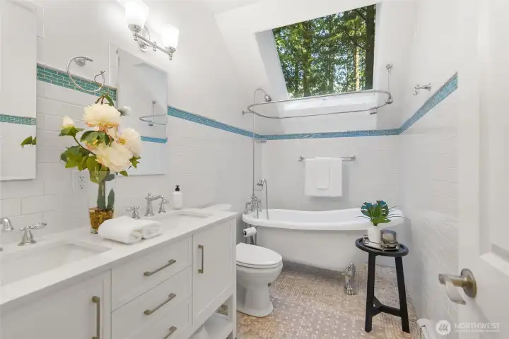 Upstairs bathroom with a large skylight. Look at the trees.