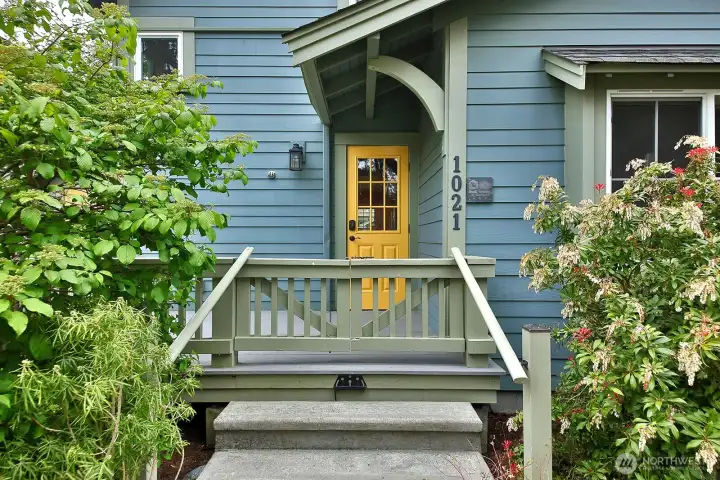 A covered front porch welcomes you on the street side.