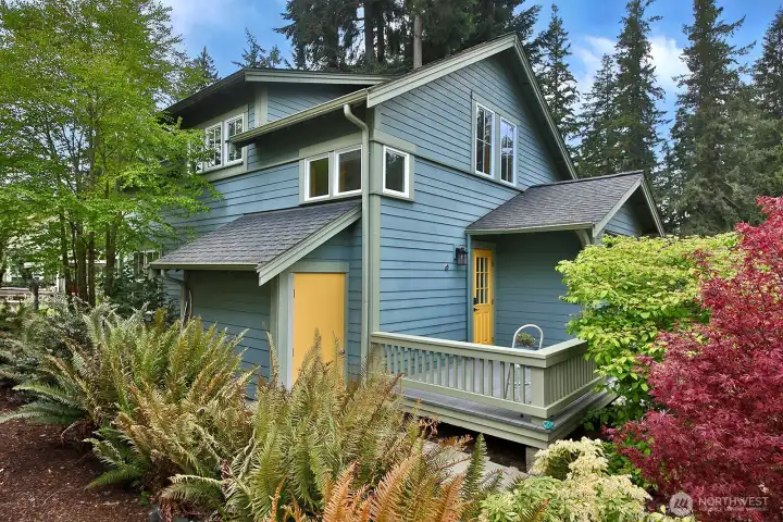 Spacious storage closet for garden tools and miscellaneous outdoor items.