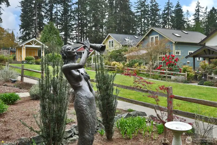 Over looking the common lawn and sidewalk.  There is a community space at in the upper left of photo for gathering.  A covered pavillion!