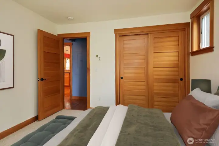 The primary bath and laundry are directly across the hall.  Virtually staged.