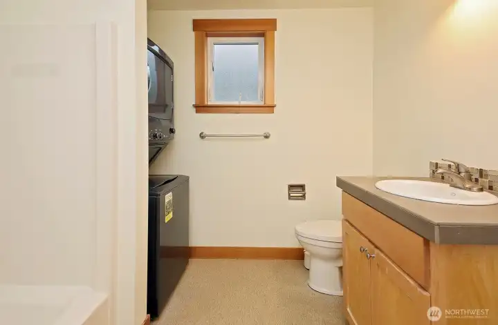 Main floor bathroom with laundry.