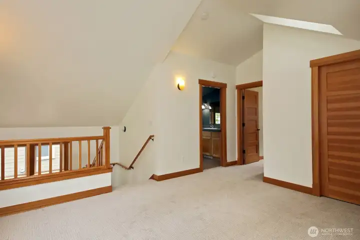 Vaulted ceilings and skylights welcome you up!