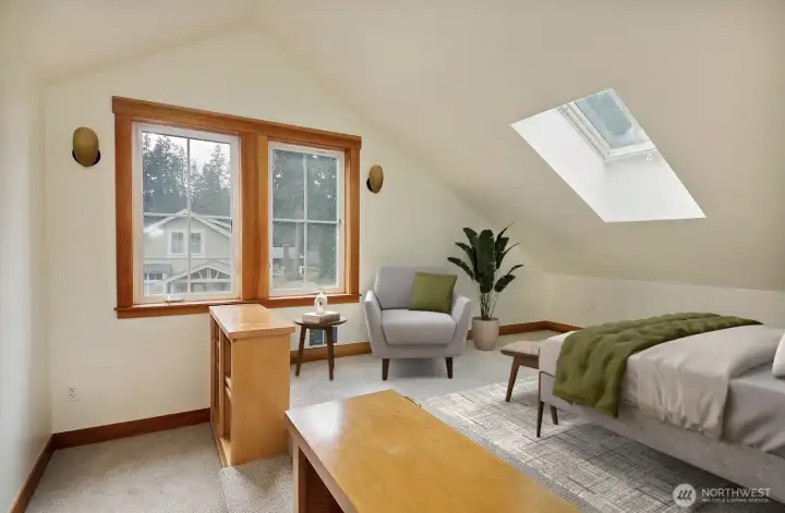 The upstairs bedroom has built in bookshelves and an oversized walk in closet.  Virtually staged.