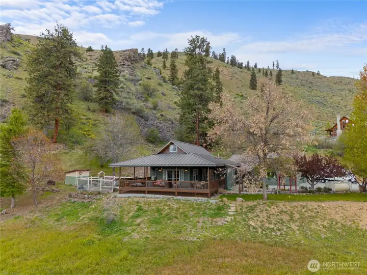 Beautifully established landscape with mature trees and seasonal wildflowers, bordering State land for added privacy. Enjoy a fenced garden with raised beds, raspberries, blackberries, and the delightful bonus of wild asparagus in the spring.