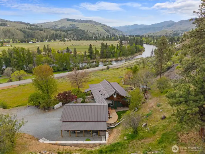 Elevated above the valley, the home captures sweeping views of the river, open meadows, and surrounding mountains while offering a private, peaceful setting