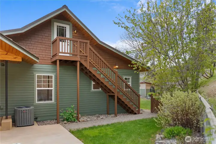 Private, fenced backyard with mature landscaping, new concrete patio with charming arbor—creating a peaceful and relaxing outdoor retreat.