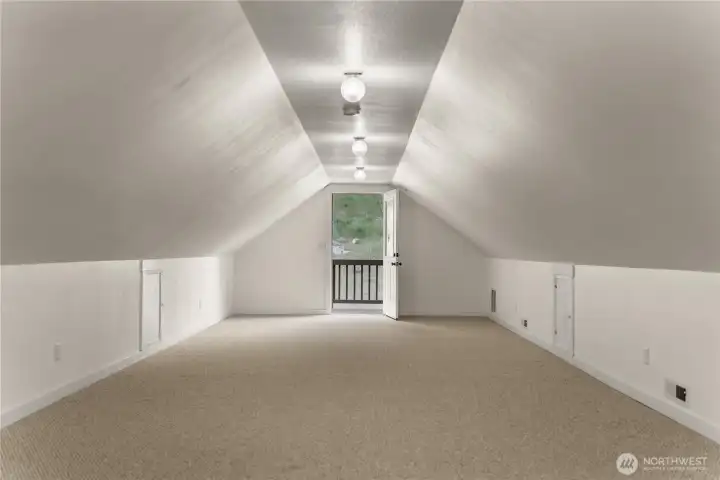 Above the house: is versatile loft area ideal for guest quarters, office, or gear room for recreation