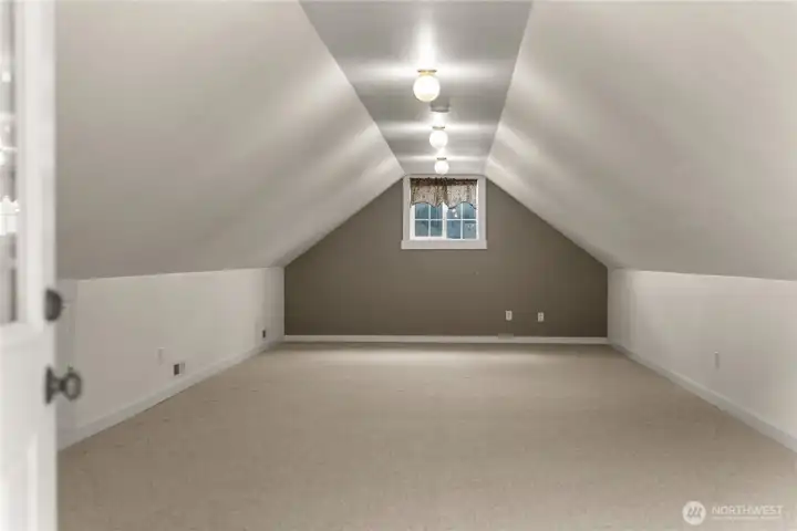 Unique upper-level layout adds flexibility and potential for bunkroom, studio, or extended living area