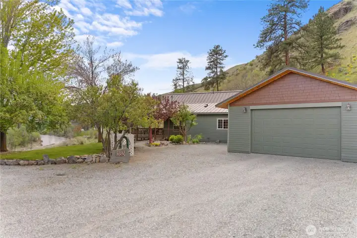 Freshly painted in a refined natural palette, the exterior offers timeless appeal and enhanced curb appeal, complemented by a covered concrete entry, expansive gravel parking, and dedicated RV space for guest convenience.