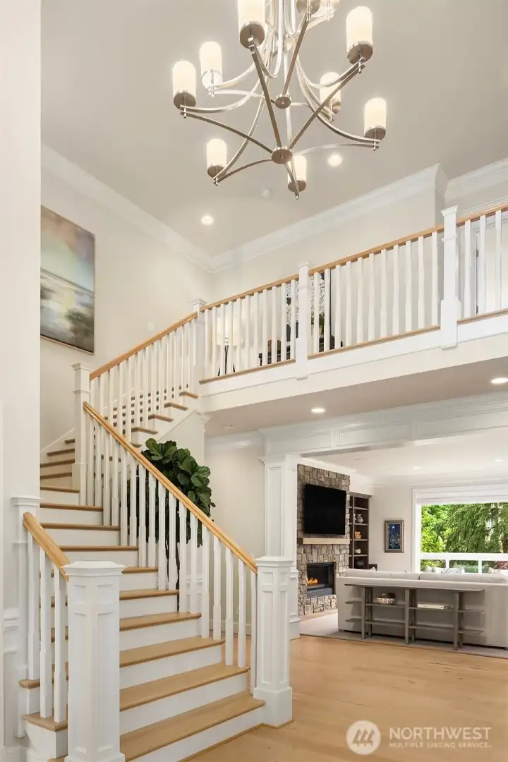 Soaring foyer with grand staircase (don't miss the secondary staircase off the garage entrance)