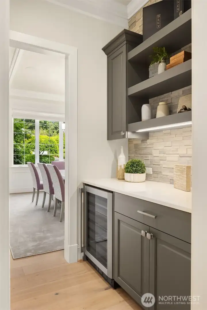 Butler's pantry off dining with wine storage and display.