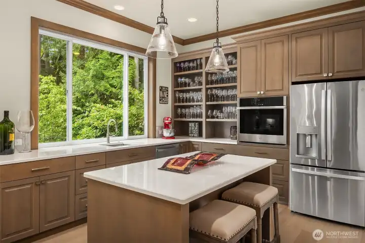 This 2nd kitchen is perfect for caterers, prepping for parties or having an intimate conversation at the island.