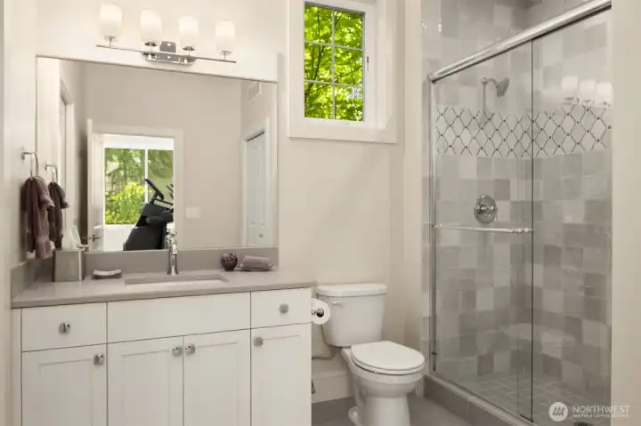 En-suite bathroom in the main floor bedroom/fitness room.