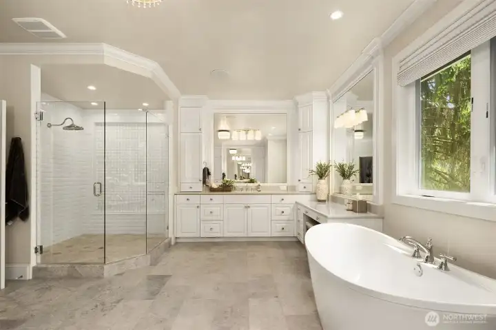Expansive 5-piece en-suite primary bath with dual vanities & custom tile shower with dual shower heads. Floor are heated for comfort from the first step.