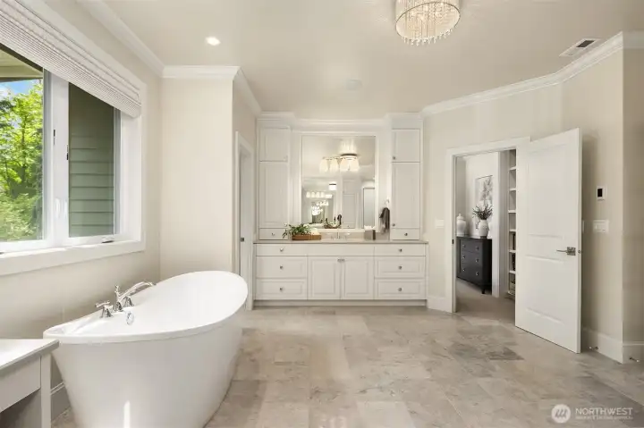 Looking toward the second vanity & sumptuous freestanding soaking tub.