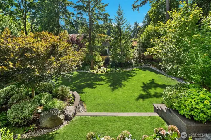 Beautifully landscaped with a backdrop of privacy trees, the backyard is a true oasis.