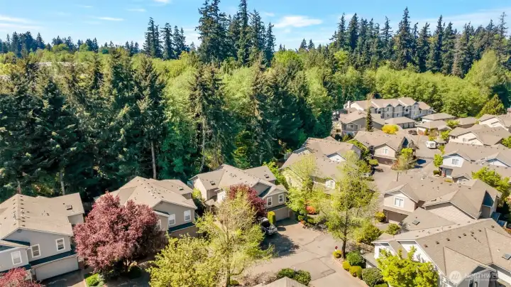 A lush greenbelt offers privacy, nature and a feeling of being miles away from it all!