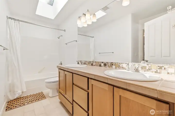 One of 3 upper level bathrooms servicing two of the befrooms.