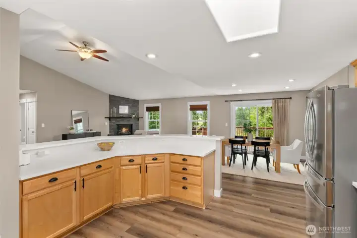 Updated kitchen with quartz counters, walk in pantry, stainless appliances, and new tile backsplash Updated kitchen with quartz counters, walk in pantry, stainless appliances, and new tile backsplash
