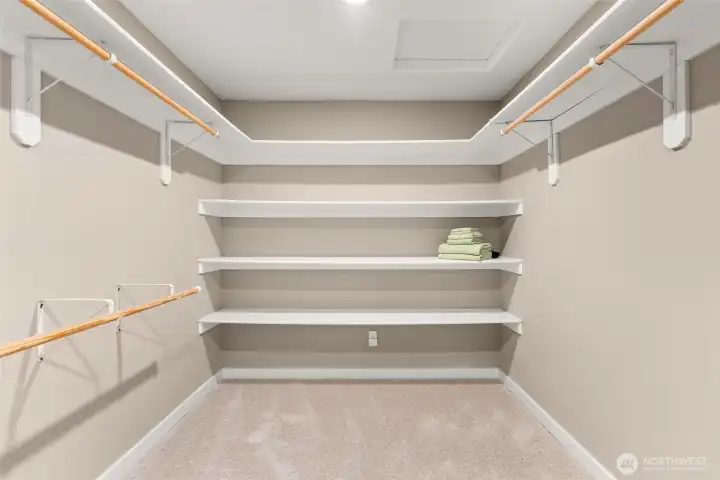 Large Primary walk in closet with shelving. Large Primary walk in closet with shelving.