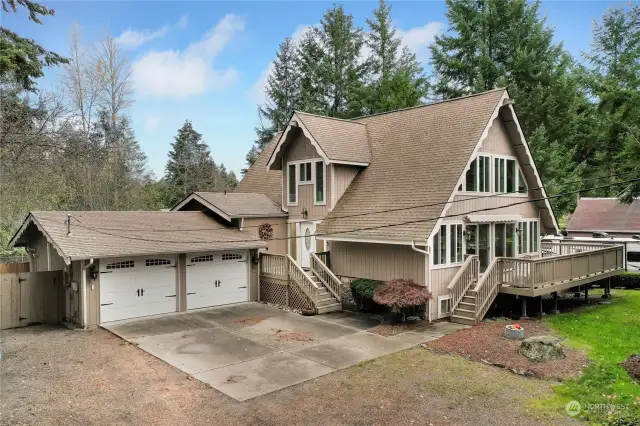 2 car garage with plenty more parking in the driveway as well as Rv Parking to the right of the home.