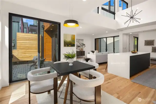 The dining room offers wonderful access to the front patio with a large sliding glass door, seamlessly blending indoor and outdoor living and creating an inviting space for al fresco dining and entertaining.