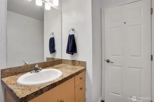 Full bath features granite countertop and ample storage space for your personal needs.
