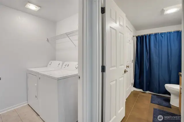 The laundry room sits adjacent to the full bathroom.