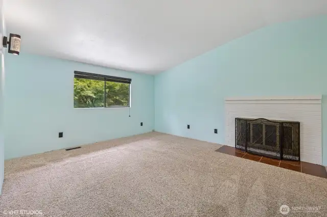Primary Bedroom, vaulted ceilings and fireplace.