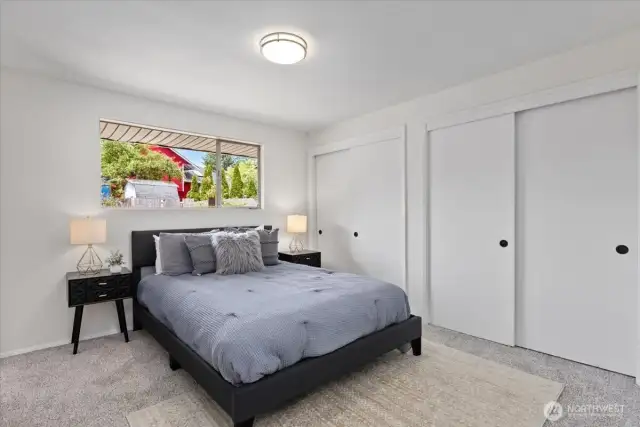 Large Primary bedroom on main floor with two large closets. Views of back yard.